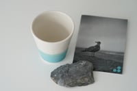 Image 3 of a cup by the sea