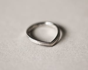 Image of Platinum 2mm width milled edge wishbone shaped ring.