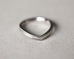 Image of Platinum 2mm width milled edge wishbone shaped ring.