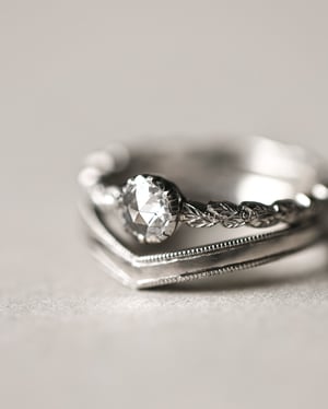 Image of Platinum 2mm width milled edge wishbone shaped ring.