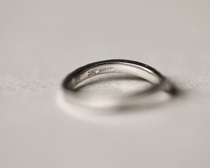 Image of Platinum 2mm width milled edge wishbone shaped ring.