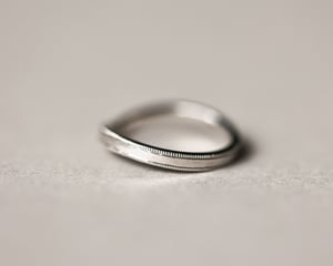 Image of Platinum 2mm width milled edge wishbone shaped ring.
