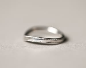 Image of Platinum 2mm width milled edge wishbone shaped ring.