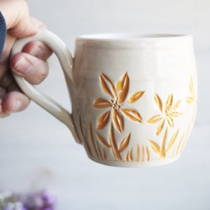 Image of Spring Flowers Carved Coffee Cup in White and Orange Glazes, Gardeners Pottery Mug, Handmade in USA