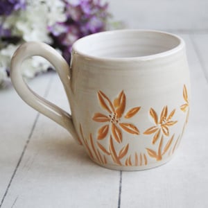 Image of Spring Flowers Carved Coffee Cup in White and Orange Glazes, Gardeners Pottery Mug, Handmade in USA