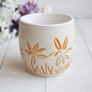 Image of Spring Flowers Carved Coffee Cup in White and Orange Glazes, Gardeners Pottery Mug, Handmade in USA