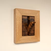Image 1 of Wood wall hook with decorative frame.