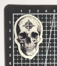 Image 2 of Glow In The Dark Skull With Strange Symbol On Forehead Glossy Finish Sticker