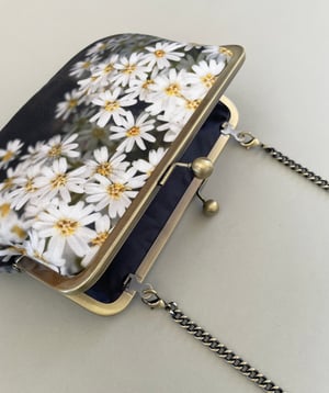 Image of Daisy flowers, printed velvet kisslock bag with crossbody canvas or chain strap