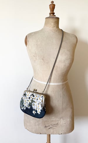 Image of Daisy flowers, printed velvet kisslock bag with crossbody canvas or chain strap