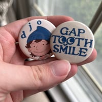 gap tooth smile / djarlie brown buttons.