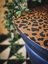 Image 2 of Black Leopard Table. 