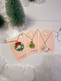 Image 1 of miniature necklace | christmas wreath, snowman, and santa frog
