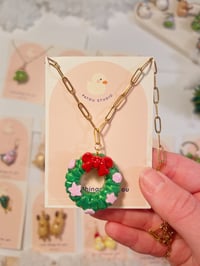 Image 2 of miniature necklace | christmas wreath, snowman, and santa frog