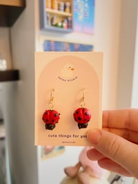 Image 2 of small ladybug earrings