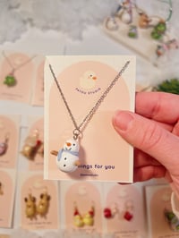 Image 4 of miniature necklace | christmas wreath, snowman, and santa frog