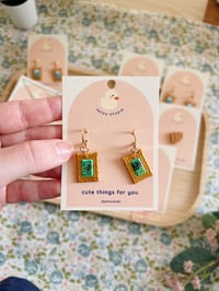 Image 3 of cottage core tiny paintings dangle earrings | cat, forest, river
