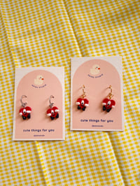 Image 1 of bad bunny hearts dangle earrings