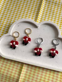 Image 4 of bad bunny hearts dangle earrings