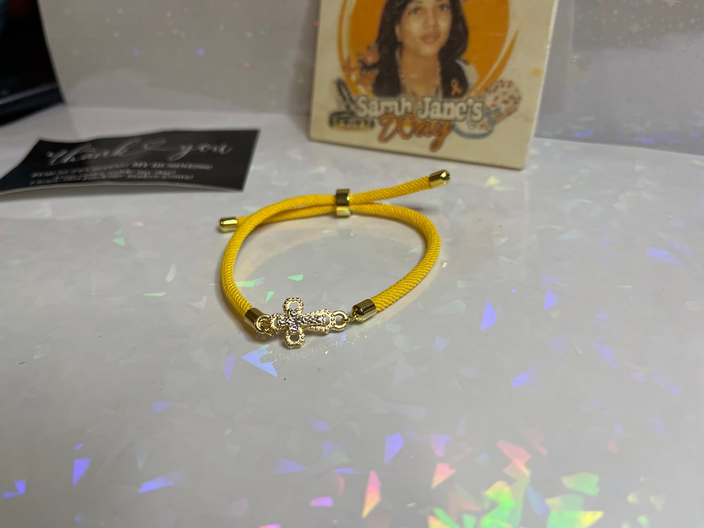 Image of Mustard yellow cross