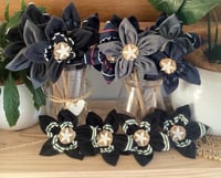 Image 1 of Memory Flowers custom created from a collection of precious polos