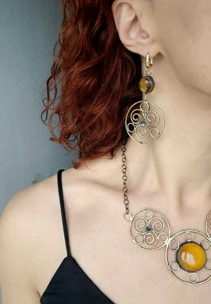 Sun necklace with yellow centre 