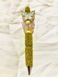 Yellow rhinestone pen with bead accents and butterfly focals