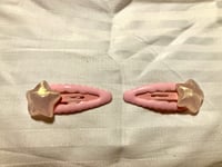 Pink shooting star barrettes