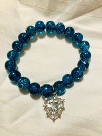 Image 2 of Bluegreen stretch 10mm glass bead bracelet with heart charm