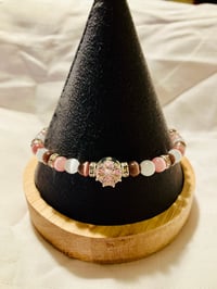 Image 1 of Glass 6mm cat's eye bead bracelet with pink crystal focal