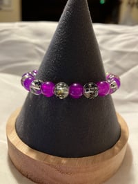 Image 1 of Purple and clear 8mm glass bead stretch bracelet
