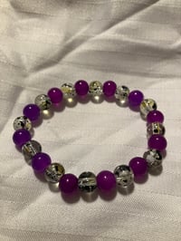 Image 2 of Purple and clear 8mm glass bead stretch bracelet