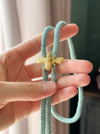 Image 1 of brass bee bolo tie