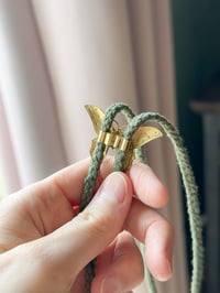Image 2 of brass butterfly bolo tie