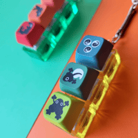 Image 2 of Life Cycle Salmon and Frog Key Clicker Keychain