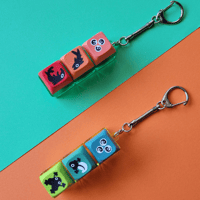 Image 1 of Life Cycle Salmon and Frog Key Clicker Keychain