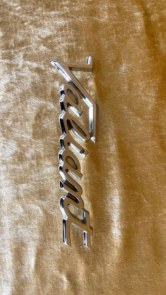 Image of VALIANT badge. Chrome restored original.