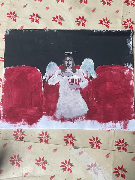 Image of angel eating popcorn
