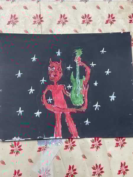 Image of devil playing guitar