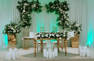 Image of Gold Square Arch with white flowers or Greenery artificial flowers . Stage as seen