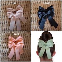 Image 1 of Double bow and tail