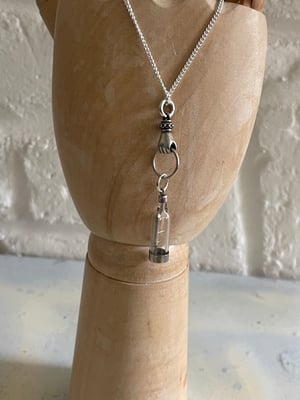 Image of Vintage silver necklace with hand & ship in a bottle charms 