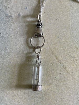 Image of Vintage silver necklace with hand & ship in a bottle charms 
