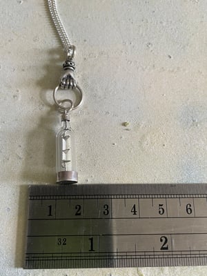 Image of Vintage silver necklace with hand & ship in a bottle charms 