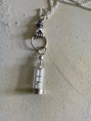 Image of Vintage silver necklace with hand & ship in a bottle charms 