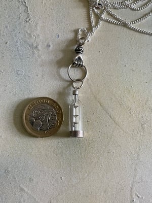 Image of Vintage silver necklace with hand & ship in a bottle charms 