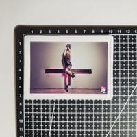 Image 2 of Woman In Latex Dress Crucified To An Upside-Down Cross Matte Vinyl Sticker 