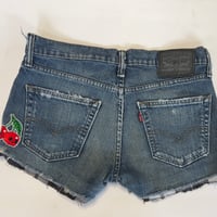 Image 2 of Women's Levis cut off jean shorts, grungey dark distressed denim  w-flannel design evil eye patch