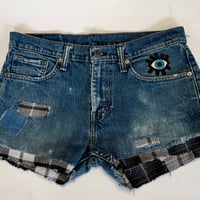Image 1 of Women's Levis cut off jean shorts, grungey dark distressed denim  w-flannel design evil eye patch