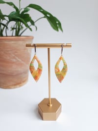 Image 1 of Peach Marble Brinns